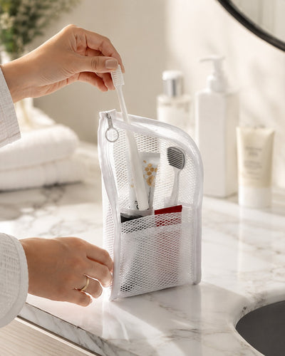 Taking a toothbrush from the white organizer
