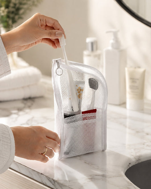 Taking a toothbrush from the white organizer